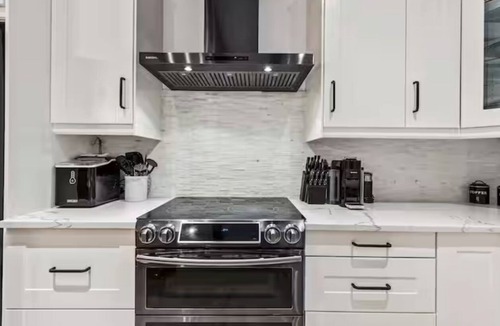 Swansea Point House | Extraordinary home with pool,hot tub, sauna, gym, arcade & theatre.