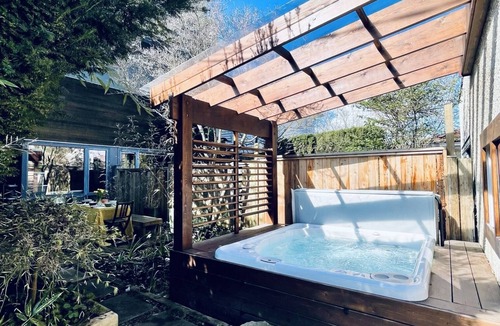East Side House | Family-friendly 3-bedroom modern home w/hot tub on park & 15 min to downtown!