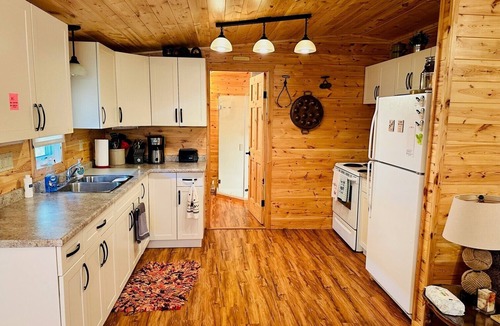 Minnedosa Cabin | Front row cabin, steps away from Minnedosa Beach, sleeps 6
