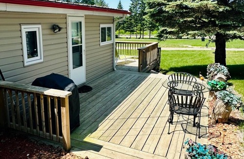 Minnedosa Cabin | Front row cabin, steps away from Minnedosa Beach, sleeps 6
