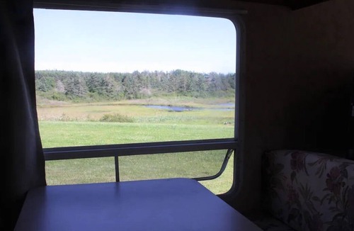 Mavillette House | Fully equipped camper on Mavillette River. Close to the beach. (pet friendly)