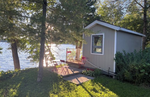 Rideau Lakes Cottage | Glamping anyone? Enjoy picturesque sunsets from your own water’s edge deck!