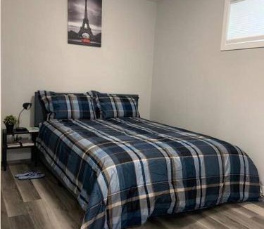 Regina Apartment | Guest Suite in Regina - Queen Bed