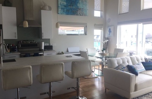 Lower Lonsdale Boat Rental | Immerse yourself in a classy & cozy, top level Floating Home! Pets welcome.