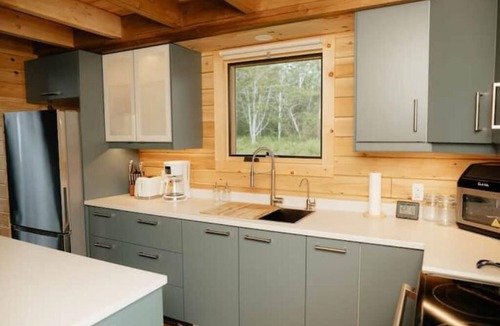 Malagash Mine House | Indulge in Serenity at The Golden Pearl: A Beautiful Log Cottage Escape