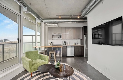 East Village Apartment | Industrial 1BR w Office, Views, AC, XL Patio