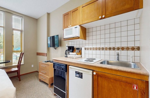 Village North Apartment | Inviting studio with hot tubs, outdoor pool, saunas & gym - walk to lifts