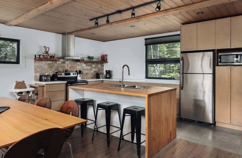 Chertsey Ski Chalet | Lakefront Nature Haven with Serene Spa