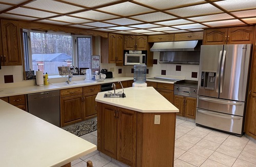Sherwood Park House | Large family or group vacation lake home with dock and boats 35 minutes from WEM