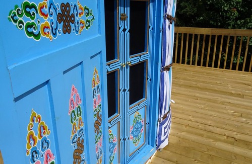 Indian Brook Resort | Large sky blue yurt at Cabot Shores Wilderness Resort