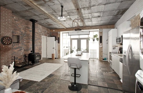 Leslieville Apartment | Leslieville LOFT with Wood Burning Fireplace and Skylights! Parking Included.