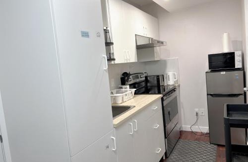 Southwest Calgary House | Lily room near golf and banff costco newly renovated queen size bed Single bathroom sofa TV