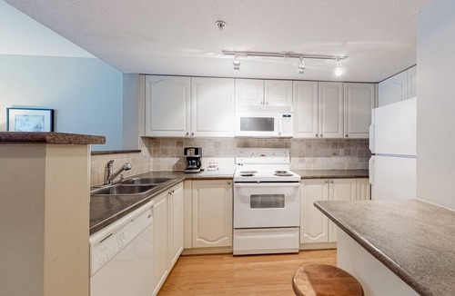 Village North House | Lovely second-floor getaway with balcony views, pool, & hot tub - walk to lifts