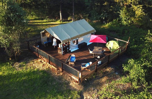 Campbell River RV Rental | Luxury Safari tent adjacent to the beach, following a nature trail to the river