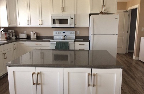 Cheticamp House | Main Floor (Unit 1) in House, Deck, Sunset, Water View (Cheticamp Harbour)