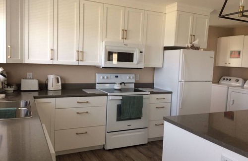 Cheticamp House | Main Floor (Unit 1) in House, Deck, Sunset, Water View (Cheticamp Harbour)