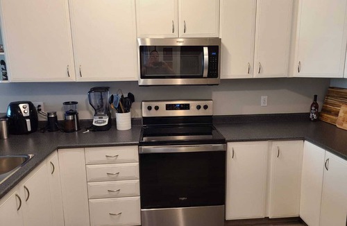 Downtown West End Condo | Modern 1BR DT Condo by Bow River & C-train w/Patio, Gym & underground parking
