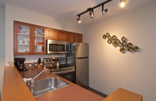 Village North House | Modern quiet townhome with private HOT TUB, GAS fireplace, common Pool and hot tub.