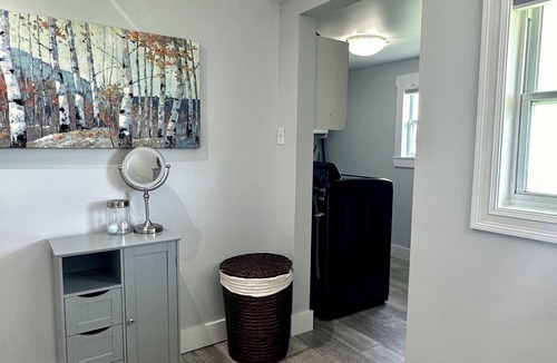 Memramcook House | Muddy River Retreat - Private backyard with Hot tub