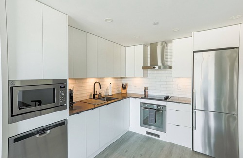 Cultural District Condo | NEW 2-bedroom condo in Downtown Kelowna with LAKE views & 25th FL access