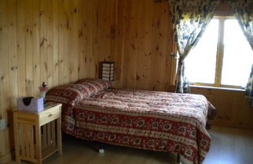 L'Ardoise West House | New Log Home with Gorgeous Ocean View in Historic Acadian Village
