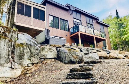 Chertsey House | Panoramic Lakefront Chalet with Hot Tub & Firepit