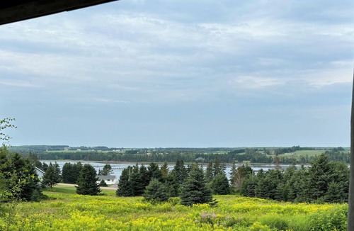Souris Cottage | Peaceful river view cottage close to world class sandy beaches