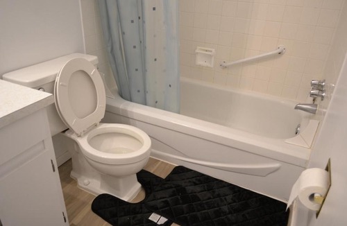 Southeast Calgary House | Private bedroom on renovated duplex main floor - Dover