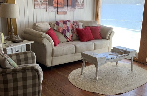 Christina Lake Cottage | Quaint Lakefront cottage that sleeps 10. Deck, hot tub and large fenced yard.