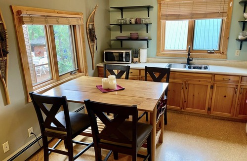 Jasper Apartment | Rare main floor suite, with full kitchen and balcony mountain views.