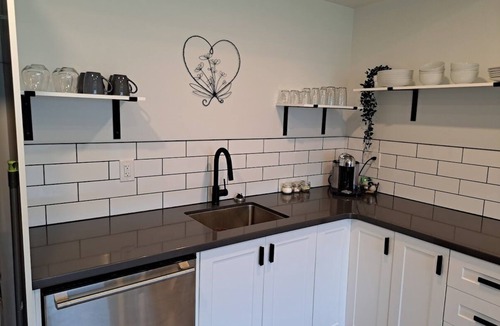 Agassiz House | River & Mountain View, Cliffside, Ground Floor Suite. 2 King Beds Private Patio.