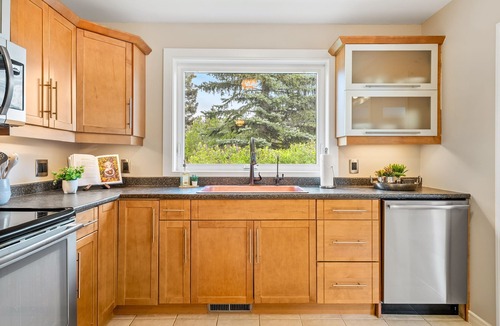Northwest Calgary House | Riverfront Oasis on Calgary’s Best Street, AC, 5BR