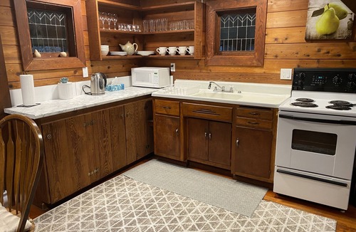 Courtenay Cabin | Rustic riverside cabin with easy access to town, trails and Mt Washington