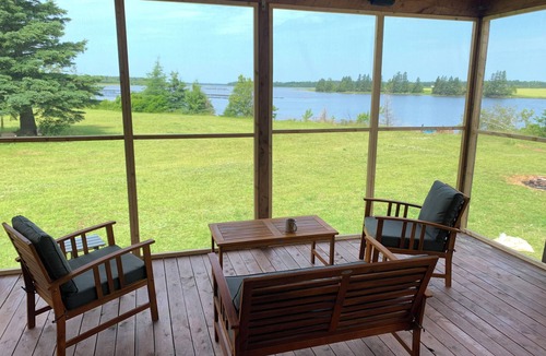 Prince County Cottage | Semi-private beach, huge screened deck, woods on fenced property