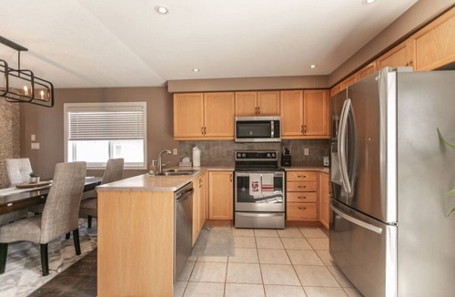Barrie House | Serenity & Style: 4BR w/Hot Tub, BBQ & Fire Table