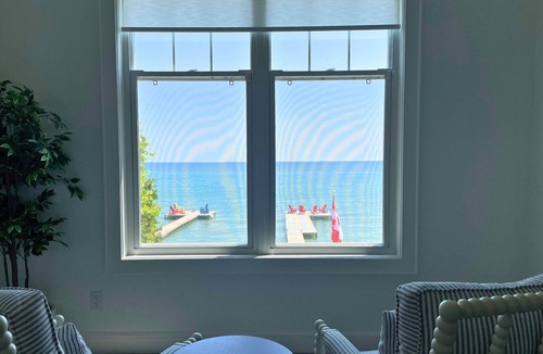 Big Bay Point Cottage | Shallow Beach Lakefront Cottage perfect with Kayak, Firepit, BBQ + Playground