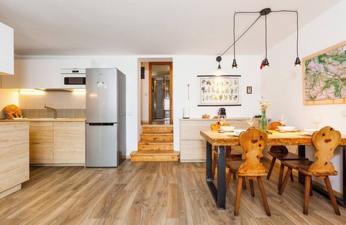 Livigno Ski Chalet | Spacious apartment with 2 bathrooms and a view of the mountains. Large lawn on the property