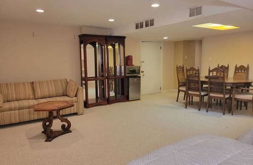 Saint-Laurent House | Spacious basement with indoor garage
