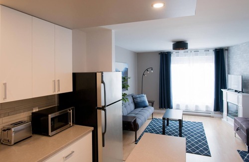 Rouyn-Noranda Apartment | Suite with cloesed bedroom and sofa bed in the city center (Le Court-toit)