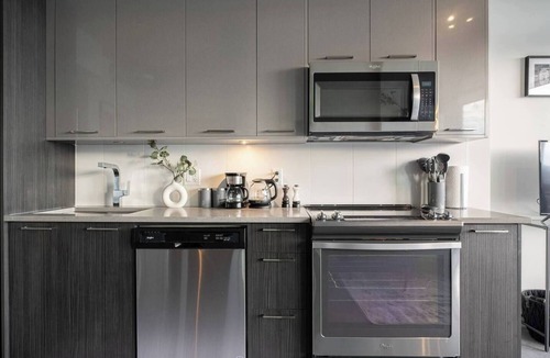 East Village Apartment | The Brixton - DT Views, by Bow River & Saddledome