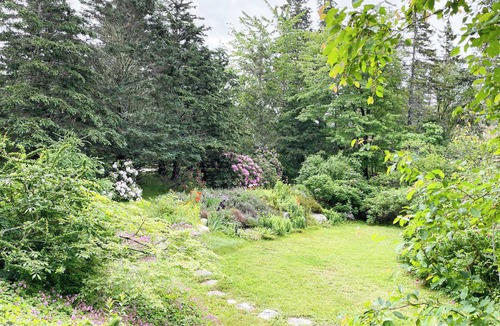 East River Point House | The oceanside Hideaway is nestled between the trees with stunning ocean views