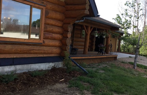 Swift Current House | Three level Log Home on Private 40 Acre Estate.