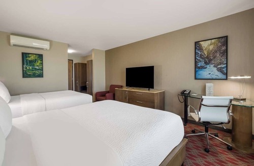 Calgary Hotel | Unwind with Ease: 2 Convenient Rooms, Indoor Swimming Pool, and Free Shuttle