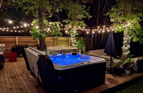 St. Andrews House | Waterfront Log Home with Beach and Hot Tub. Pet Friendly!
