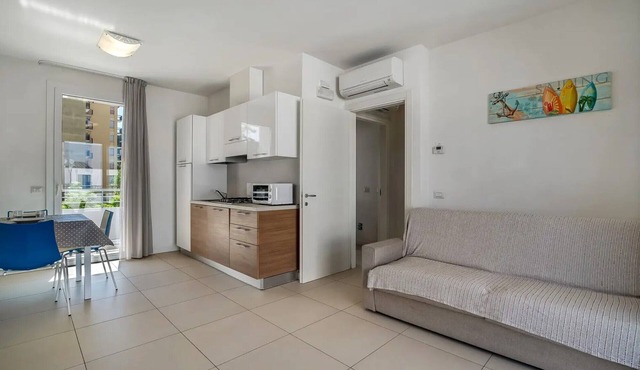 Apartment 'Blu Village' with Shared Pool, Private Terrace, and Air Conditioning
