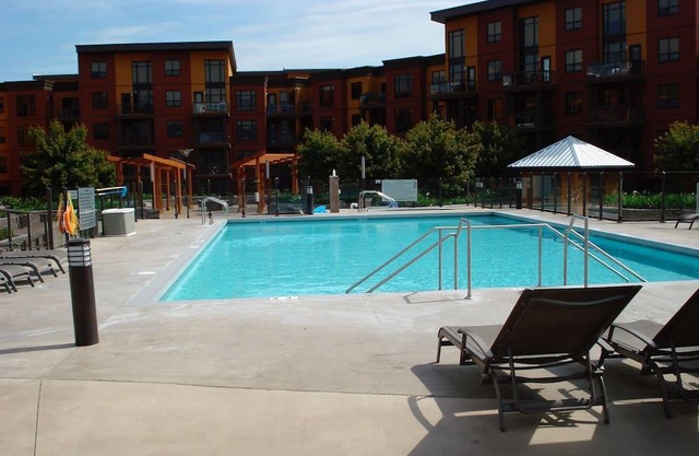 View of a courtyard with a pool and view of the mountains