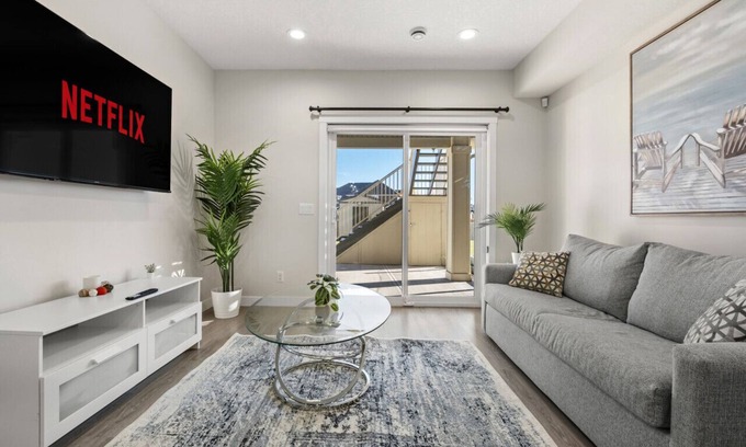 Sage Hill Apartment | 1BR Walk Out Suite » Backyard » Patio » 65” TV