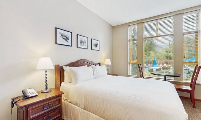 Village North Apartment | Inviting studio with hot tubs, outdoor pool, saunas & gym - walk to lifts