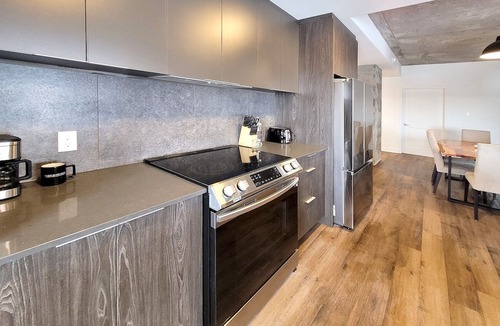 Fabreville Apartment | Corporate Stays - Elegant 3BR with Rooftop, Gym & Lounge